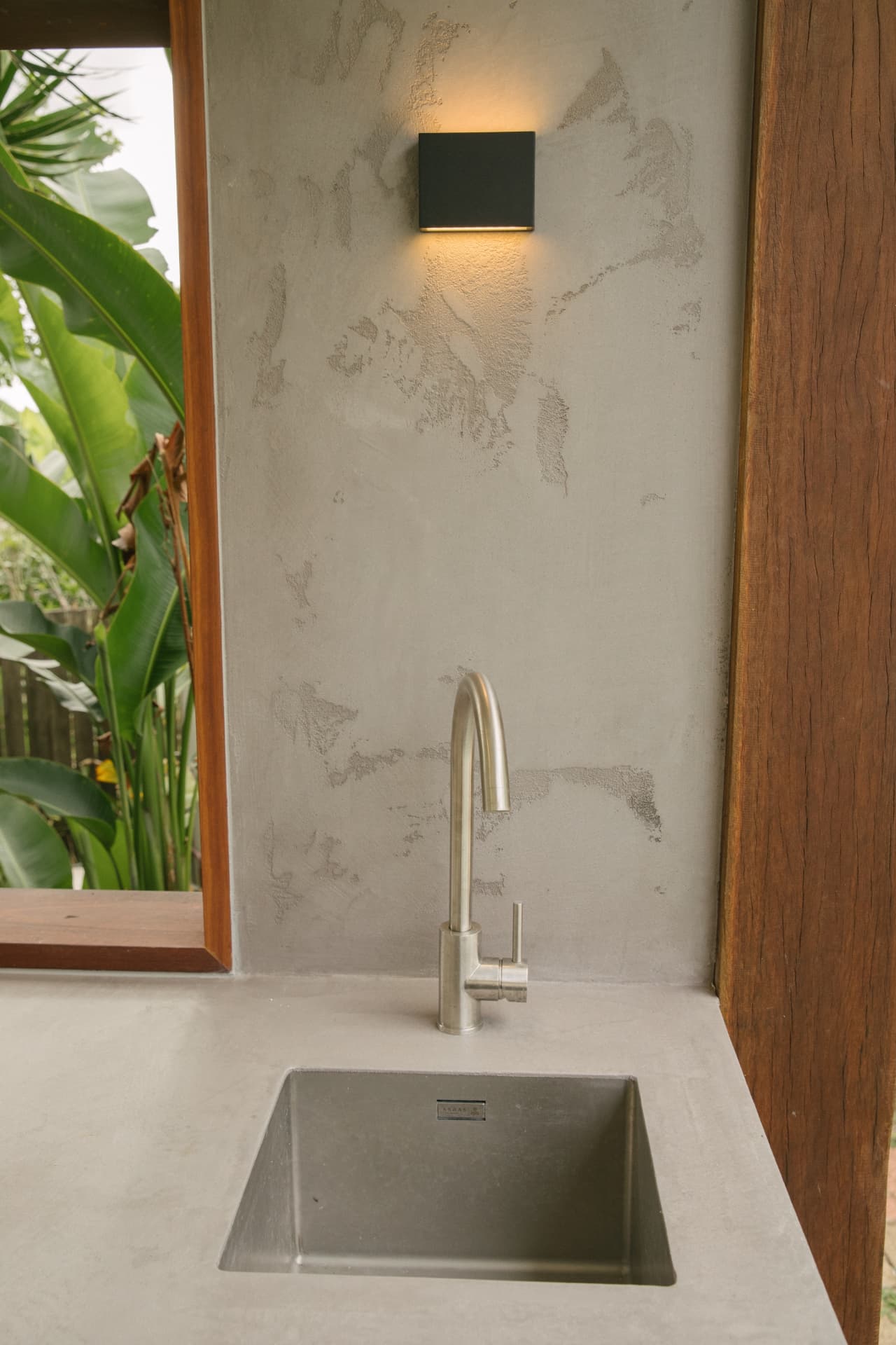 Stainless sink against hand-trowelled Venetian plaster